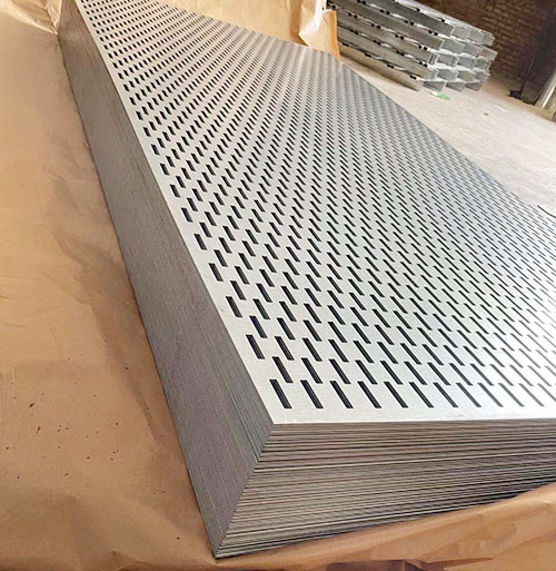 The leveler is leveling the perforated metal plate.